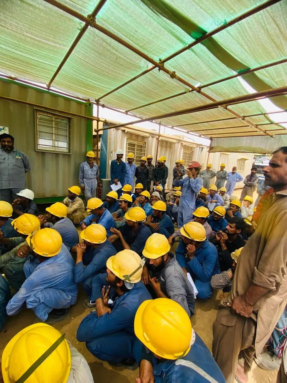MEEC site crew attending an HSE toolbox talk before starting work